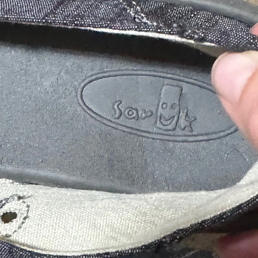 Sanuk slip sidewalk